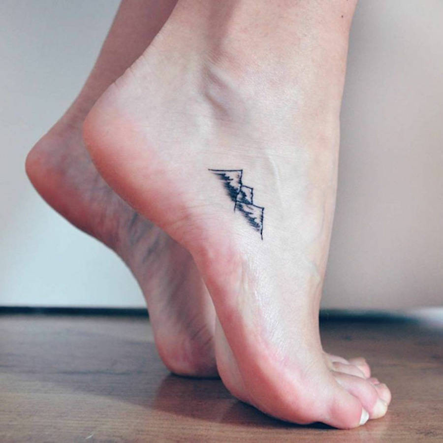 Mountain tattoo designs There's a lot of meaning to glean from a minimalist mountain  tattoo. They are used to represent a no-frills… | Instagram